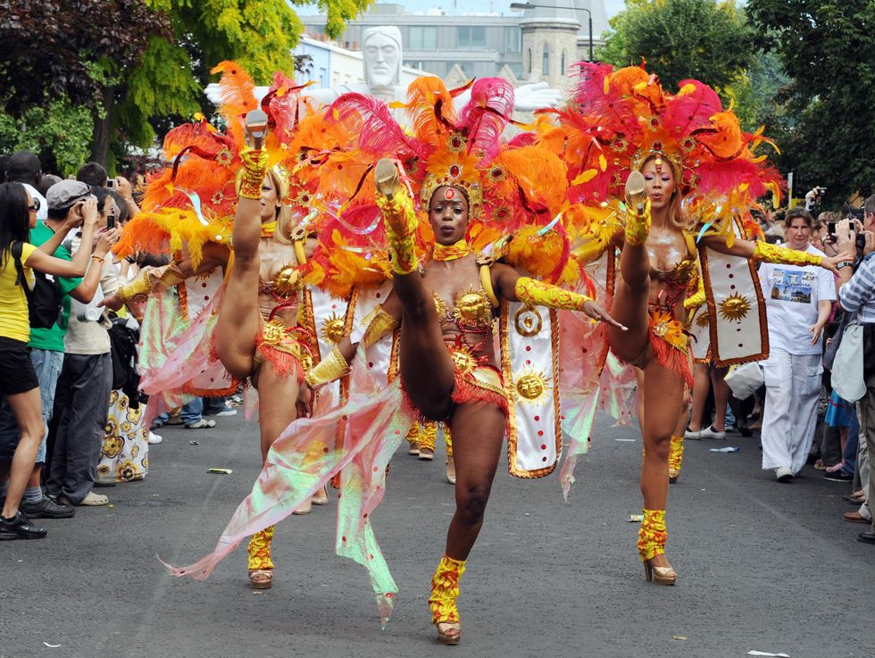 Dancers perform during the Notting Hill Carnival in west London (Fiona Hansen/PA)