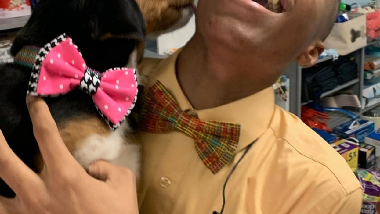 Darius Brown and a dog with a bow tie