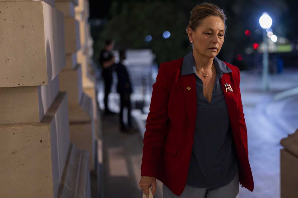 Darline Graham walking up some steps in Congress.