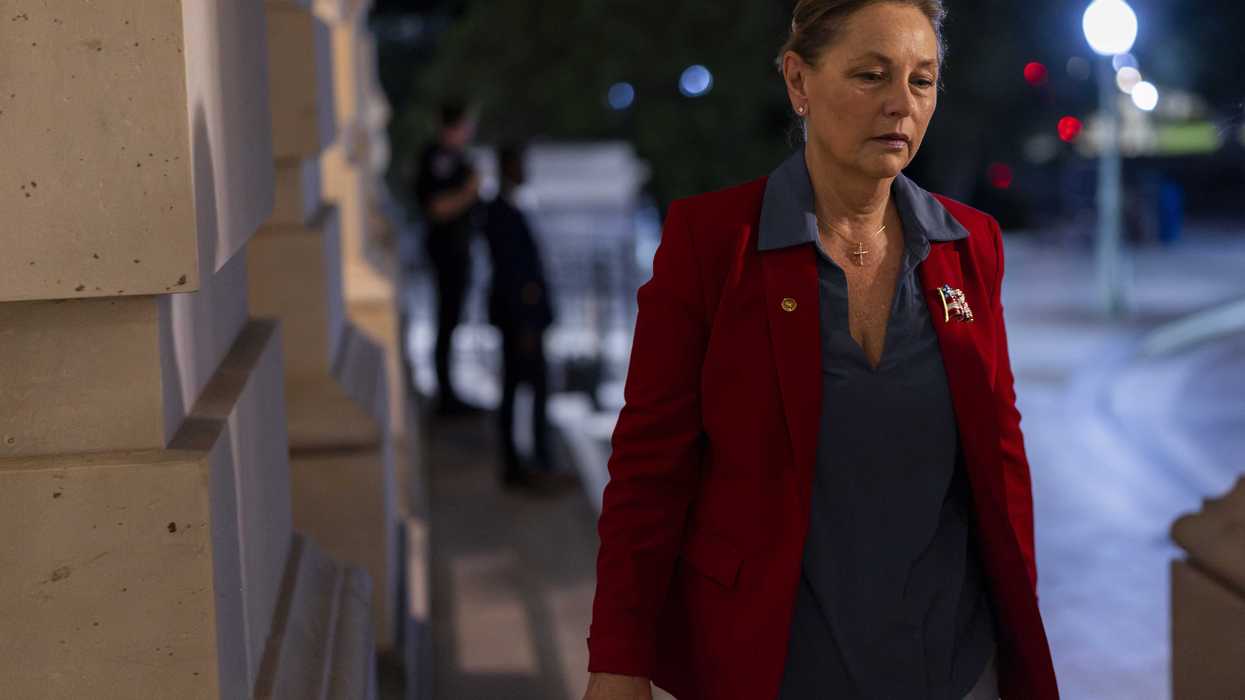 Darline Graham walking up some steps in Congress.