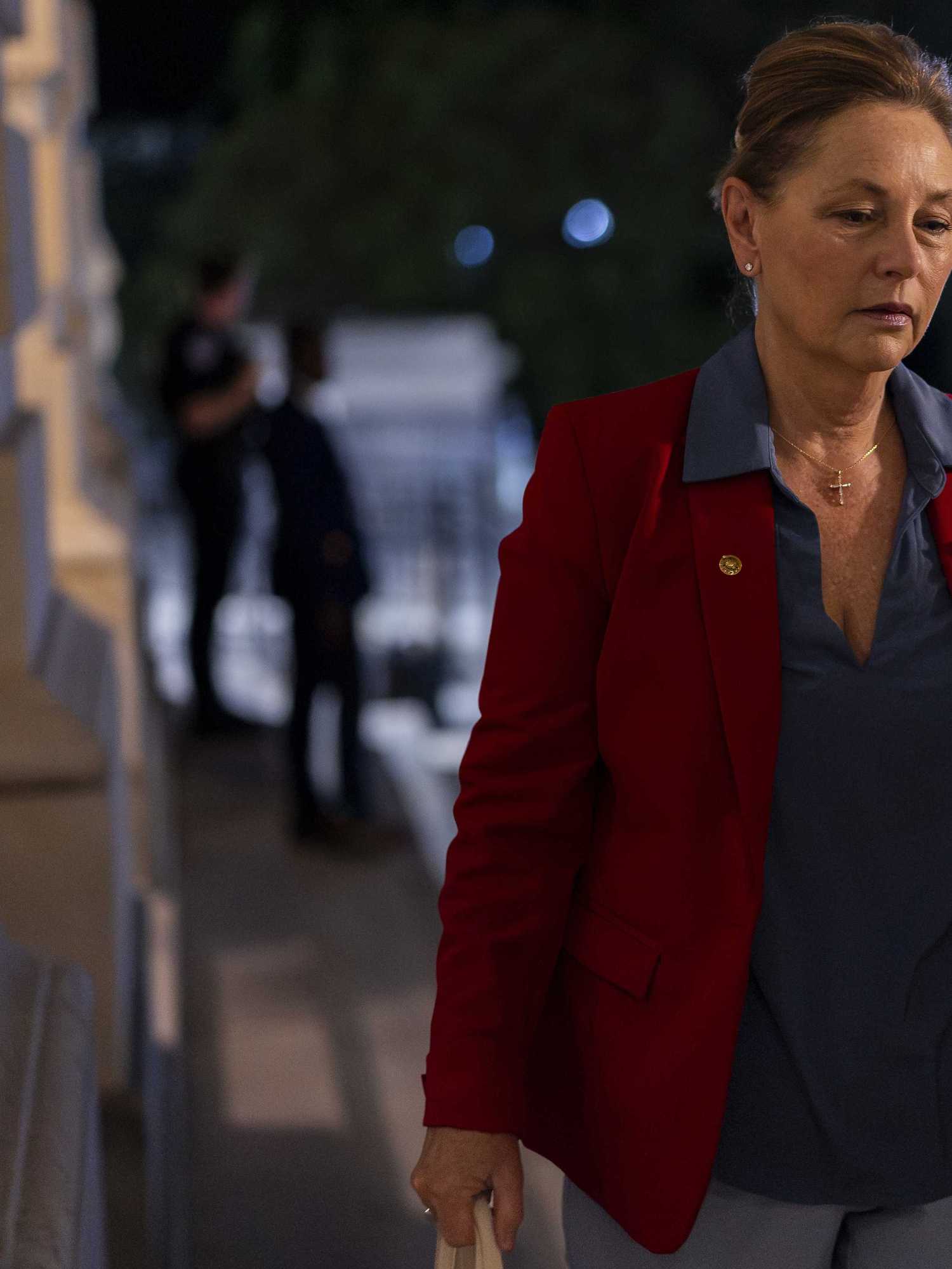 Darline Graham walking up some steps in Congress.