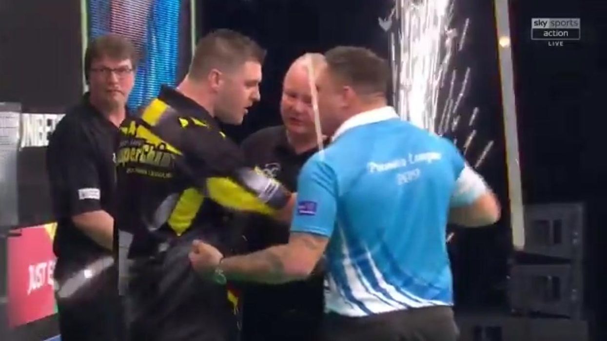 Darts player becomes instant meme after wearing ear defenders to block out crowd