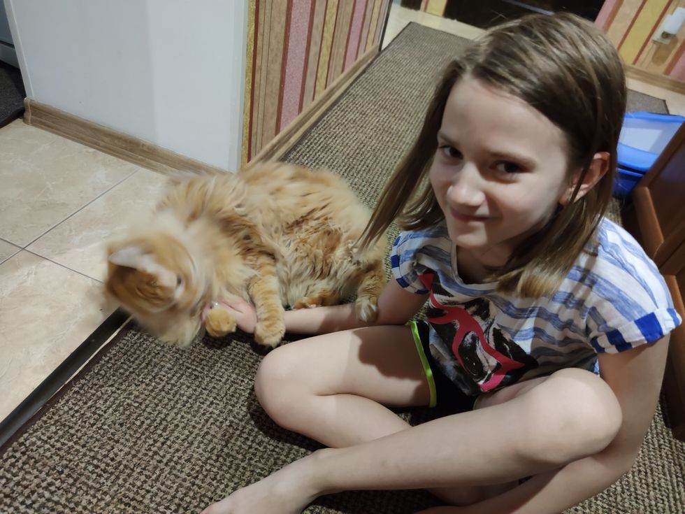 Dasha with her cat.