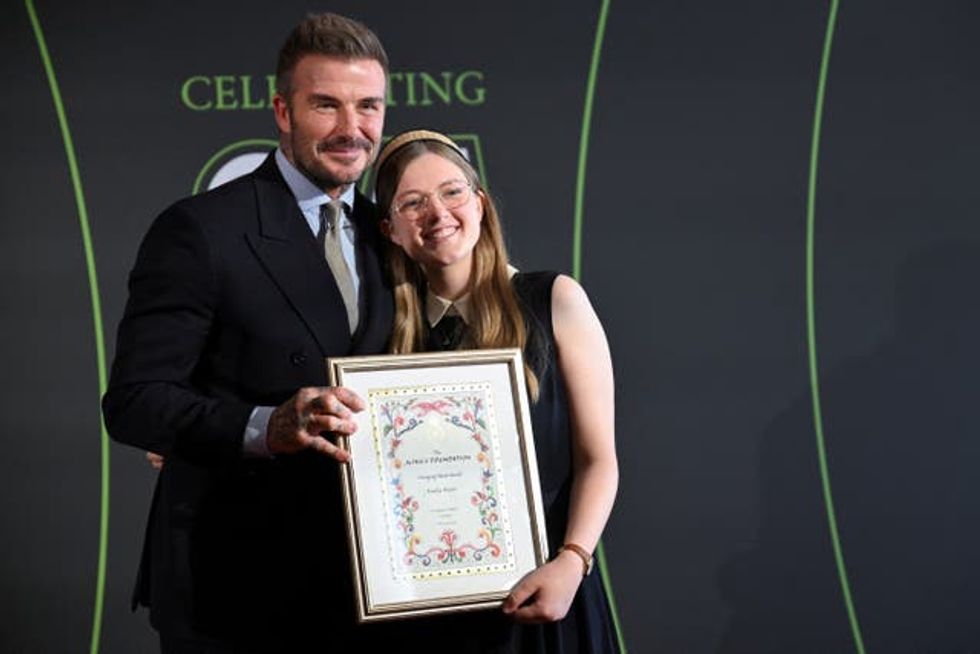 David Beckham presenting the emerging talent award to Emily Hurst during the King\u2019s Foundation Awards ceremony