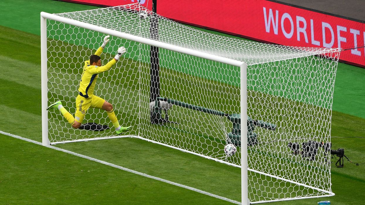 <p>David Marshall attempted to save the shot</p>