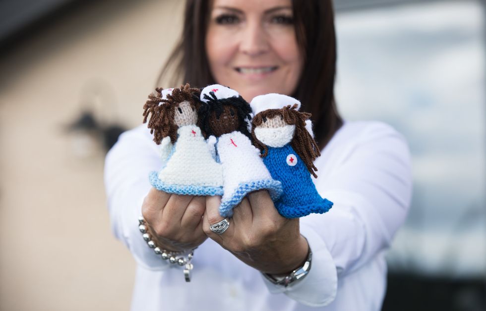 Debbie Goolding with her angel mascots (Chris Ratcliffe/National Lottery/PA)