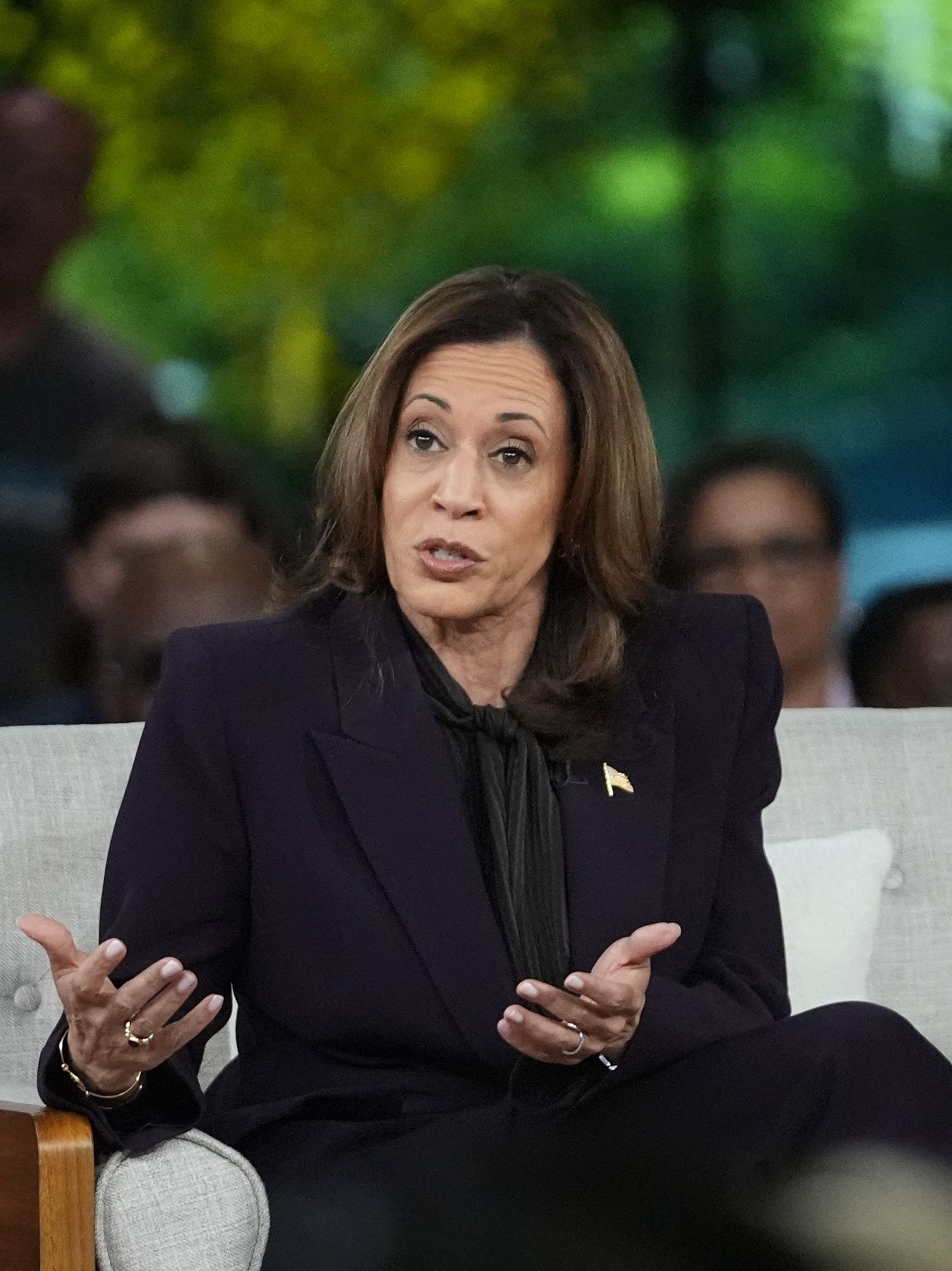 Democratic presidential nominee Vice President Kamala Harris answers an audience member's question as she joins Oprah Winfrey at Oprah's Unite for America Live Streaming event Thursday, Sept. 19, 2024 in Farmington Hills, Mich