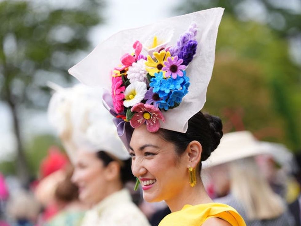 Designer and milliner Angela Menz wearing a hat she created from pipe cleaners