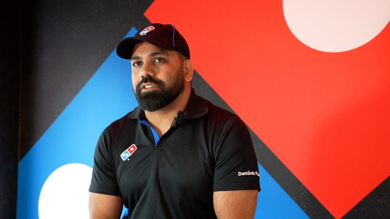 Man who learnt to speak English from Domino's pizza menu has opened up his own store