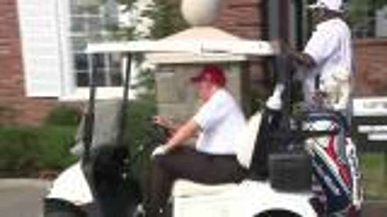 Trump hilariously heckled by pranksters as he takes a swing on his own golf course