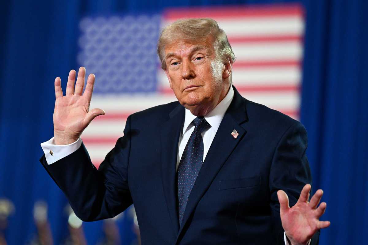 Donald Trump dances on stage.