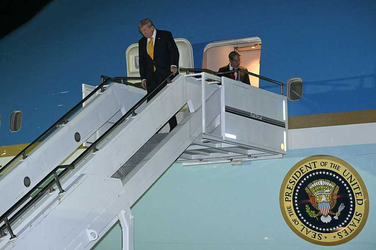 Donald Trump disembarks Air Force One.