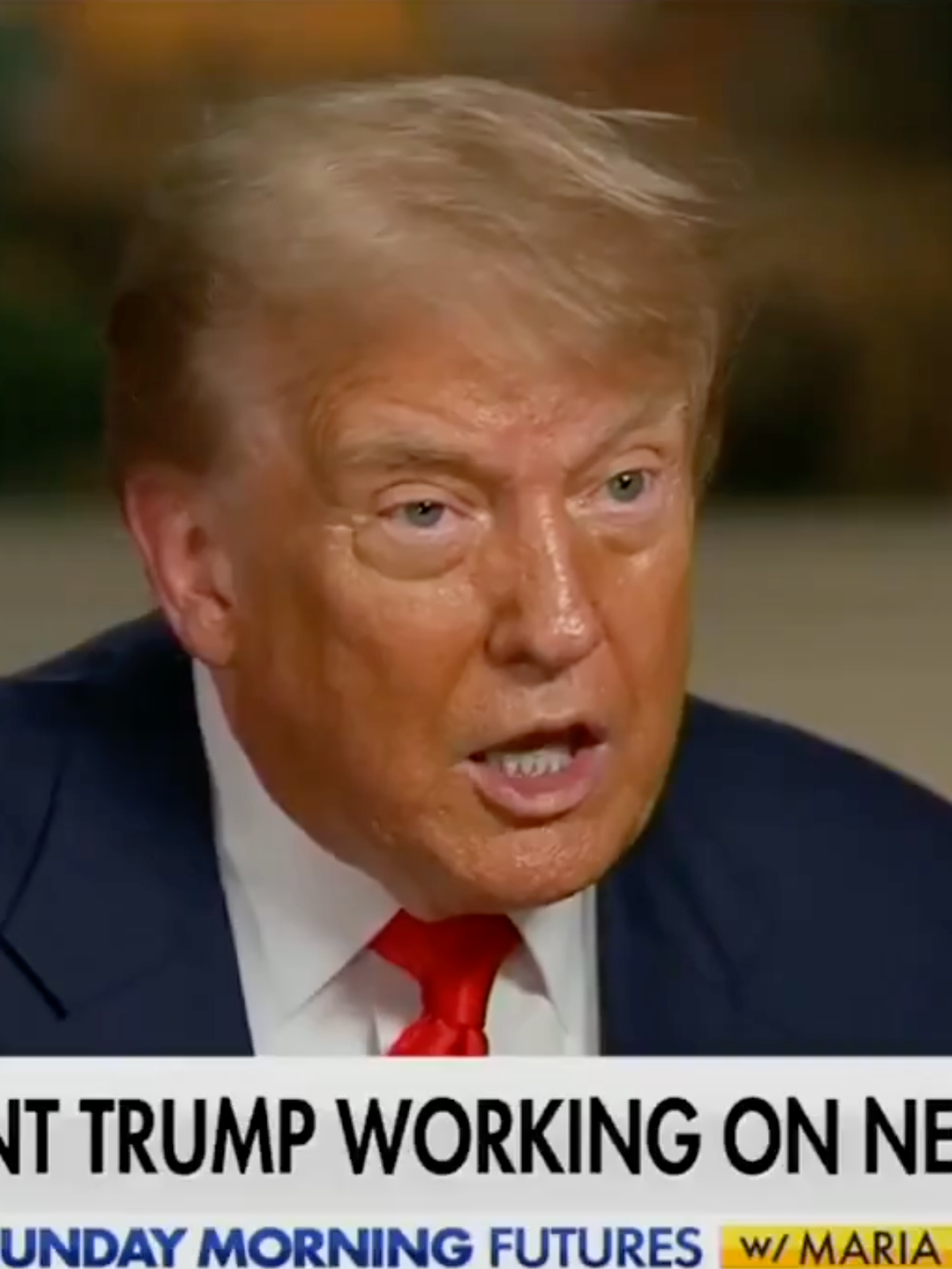 Donald Trump giving an interview to Fox News, with the chyron below him reading: 'President Trump working on new trade deals'.