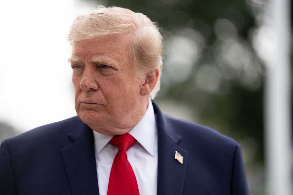 Donald Trump, looking to his right.