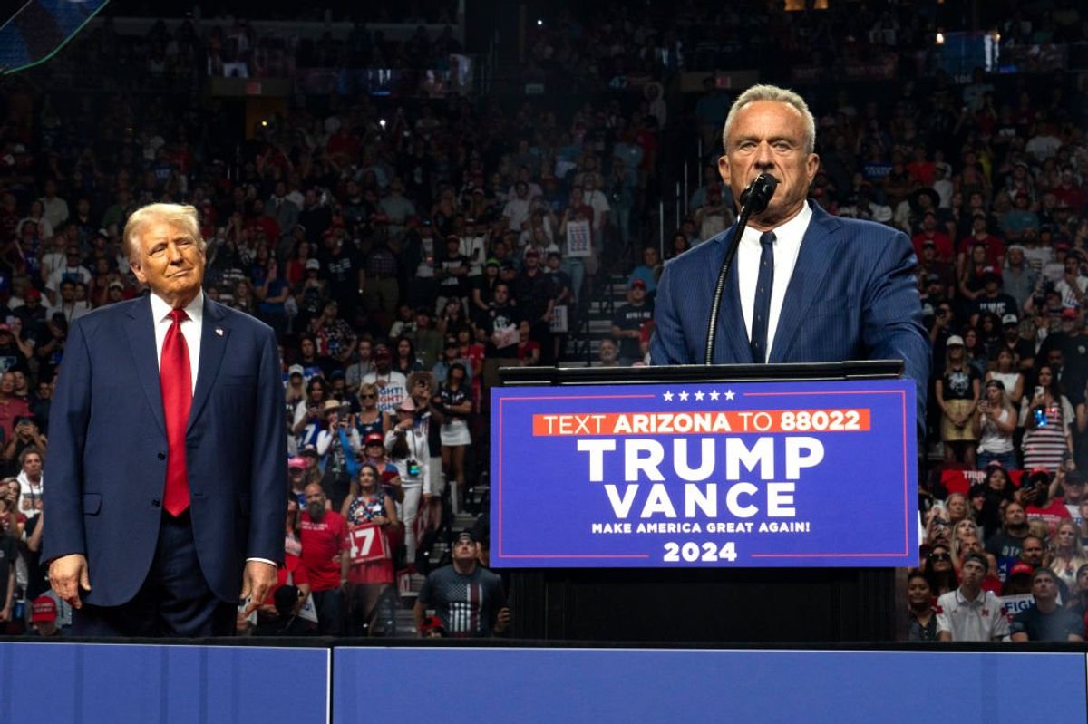 Donald Trump looks on as Robert F Kennedy Jr delivers a speech at his presidential rally in Arizona