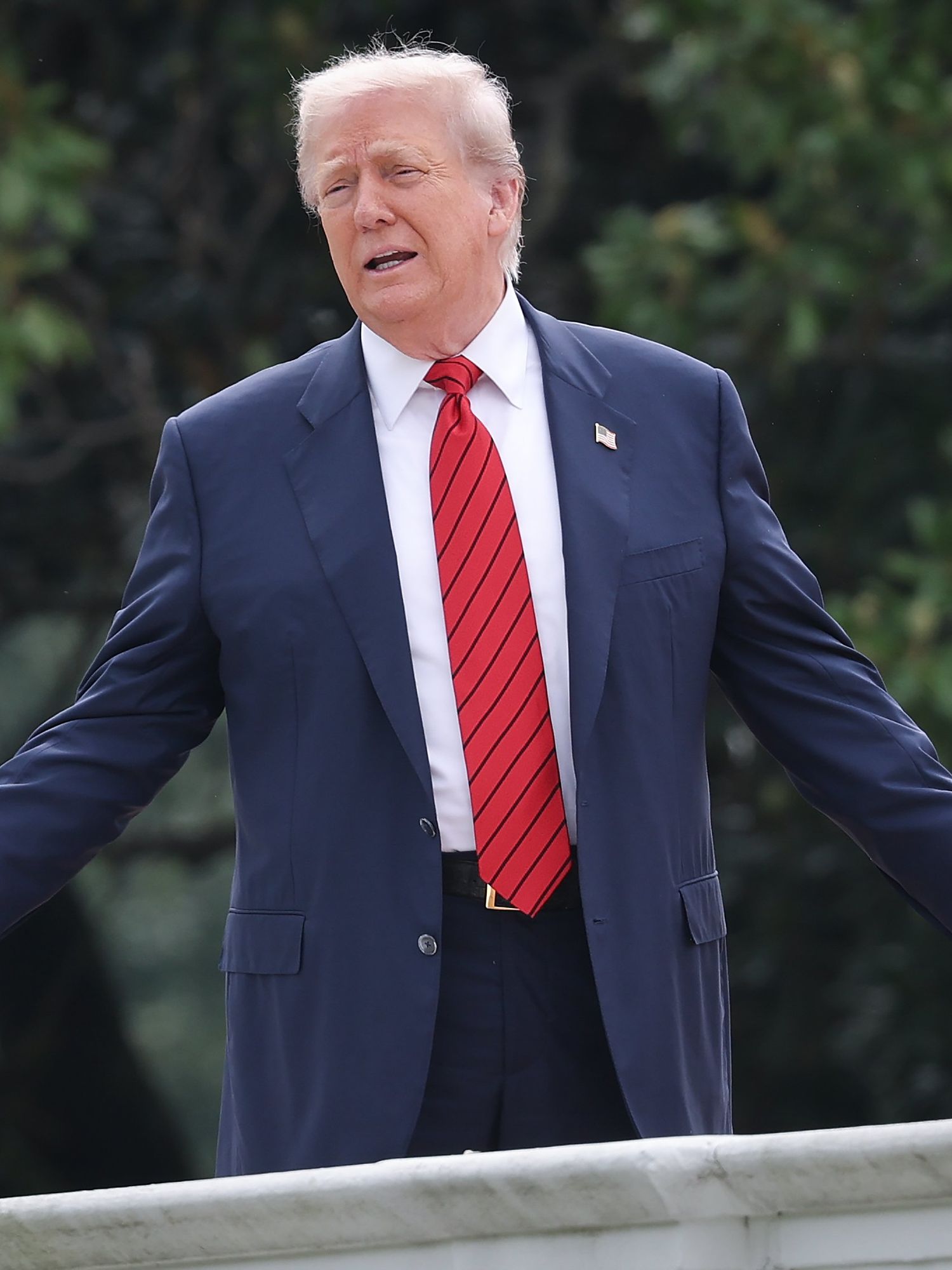 Donald Trump on the roof of the White House, with his arms outstretched.