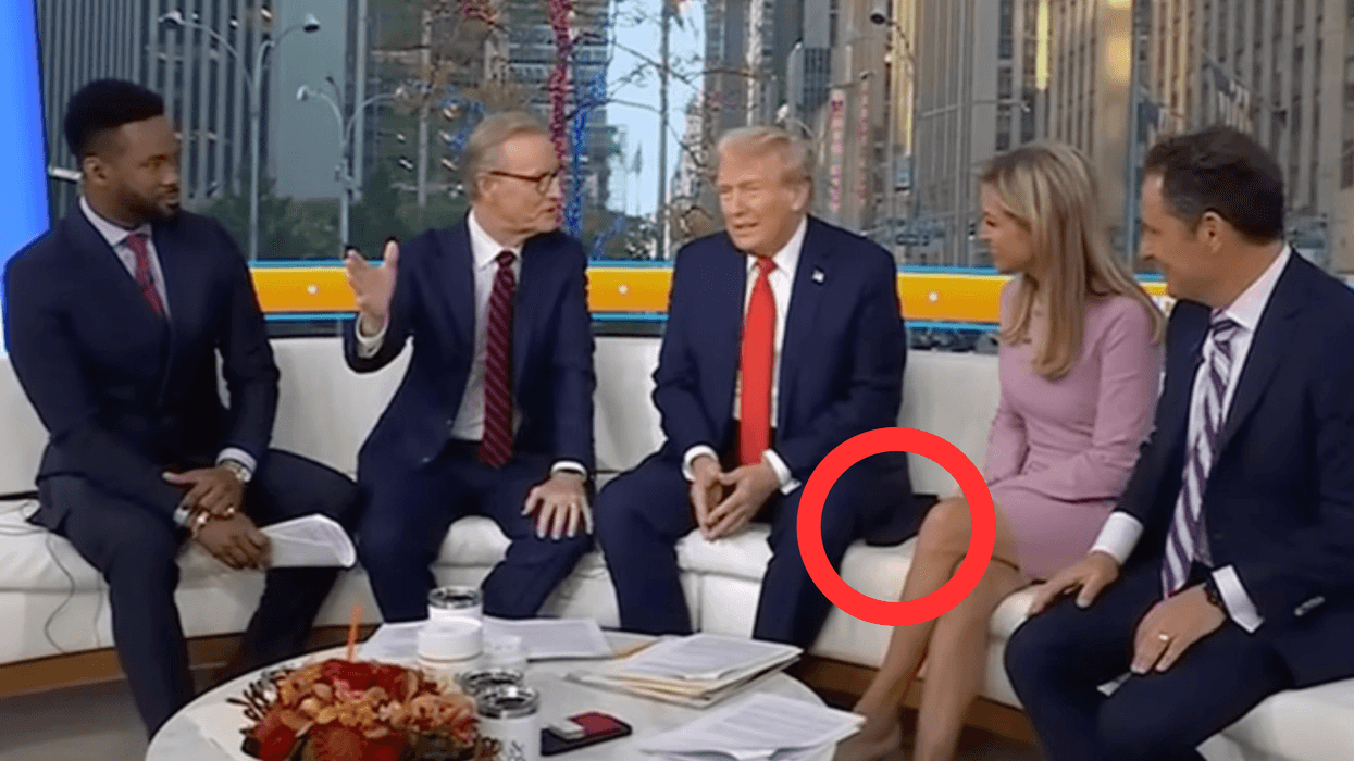 Donald Trump on the white Fox and Friends sofa, with a section of his suit jacket circled in red.