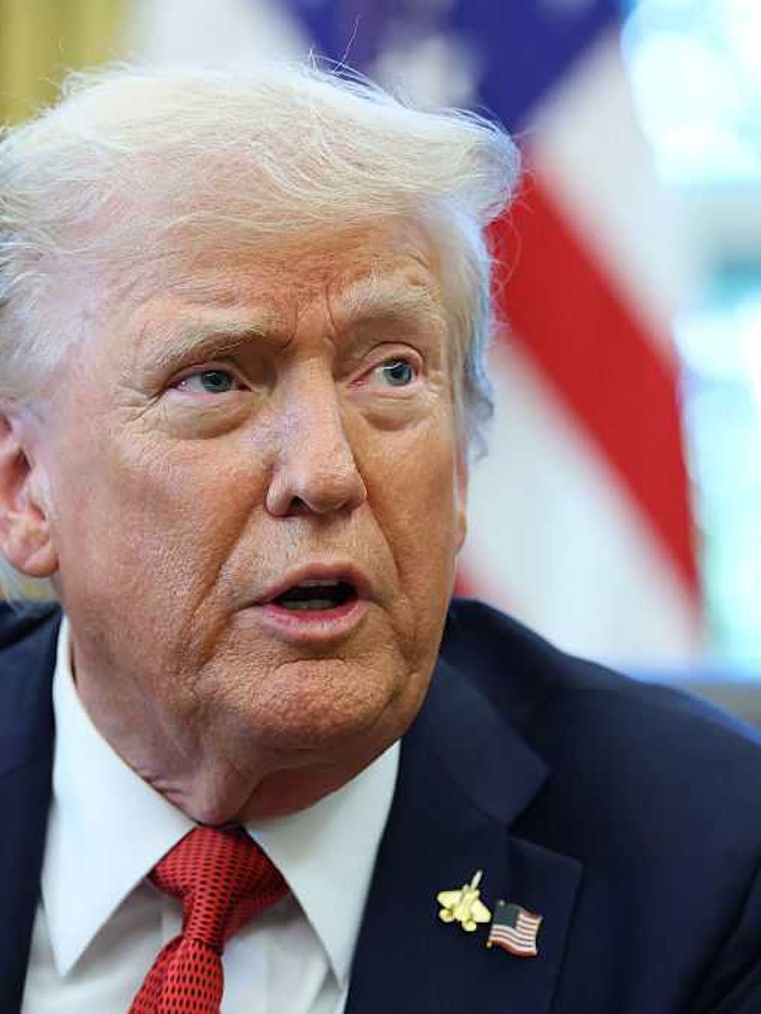 Donald Trump speaking to reporters in the Oval Office.