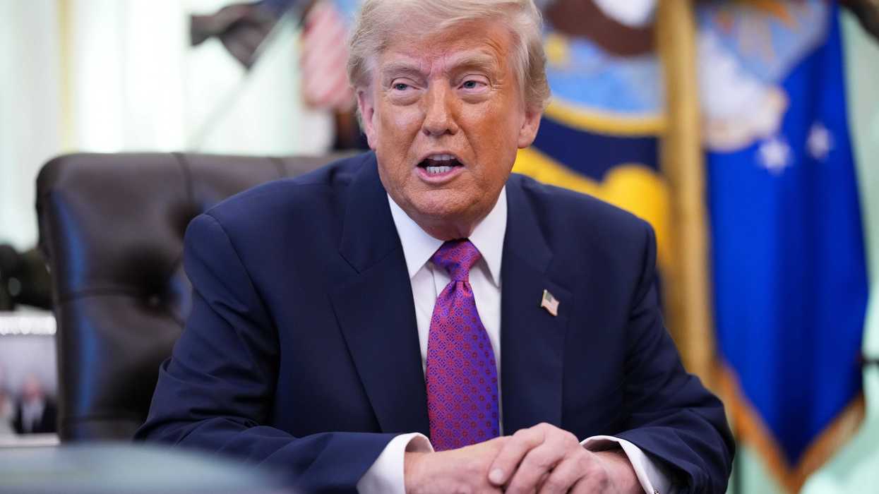 Donald Trump speaking to reporters in the Oval Office.