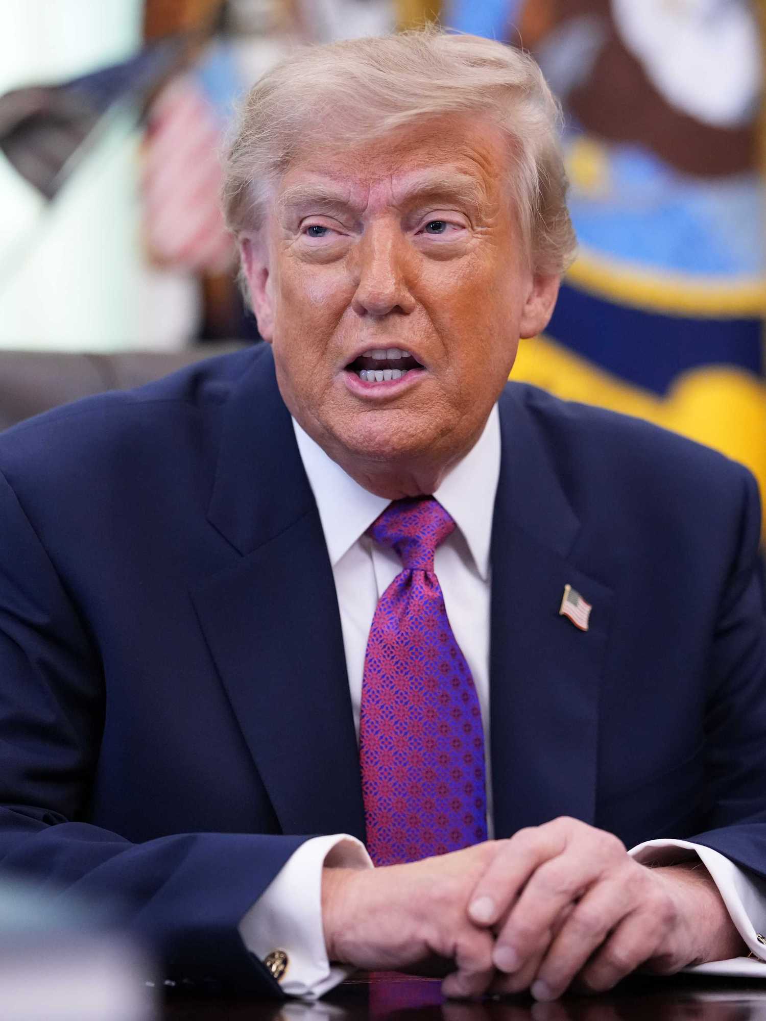 Donald Trump speaking to reporters in the Oval Office.