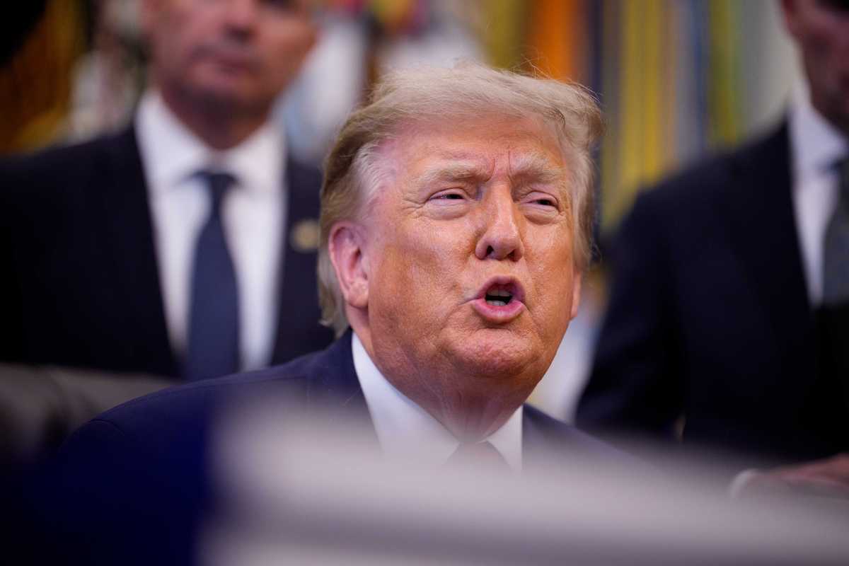 Donald Trump speaking to reporters inside the Oval Office.