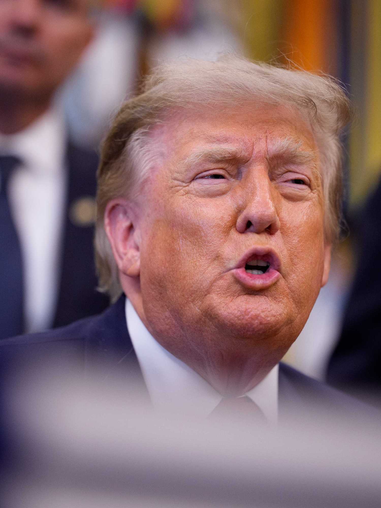 Donald Trump speaking to reporters inside the Oval Office.