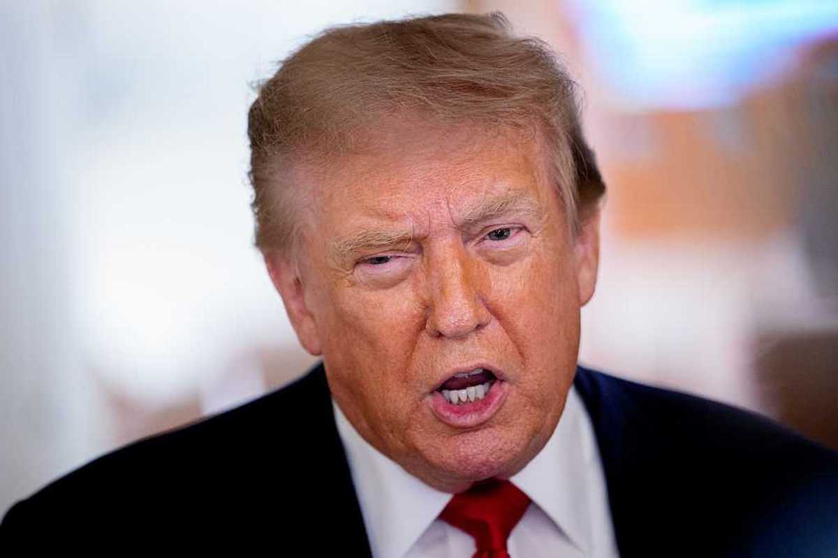 Donald Trump speaking to reporters on board Air Force One.