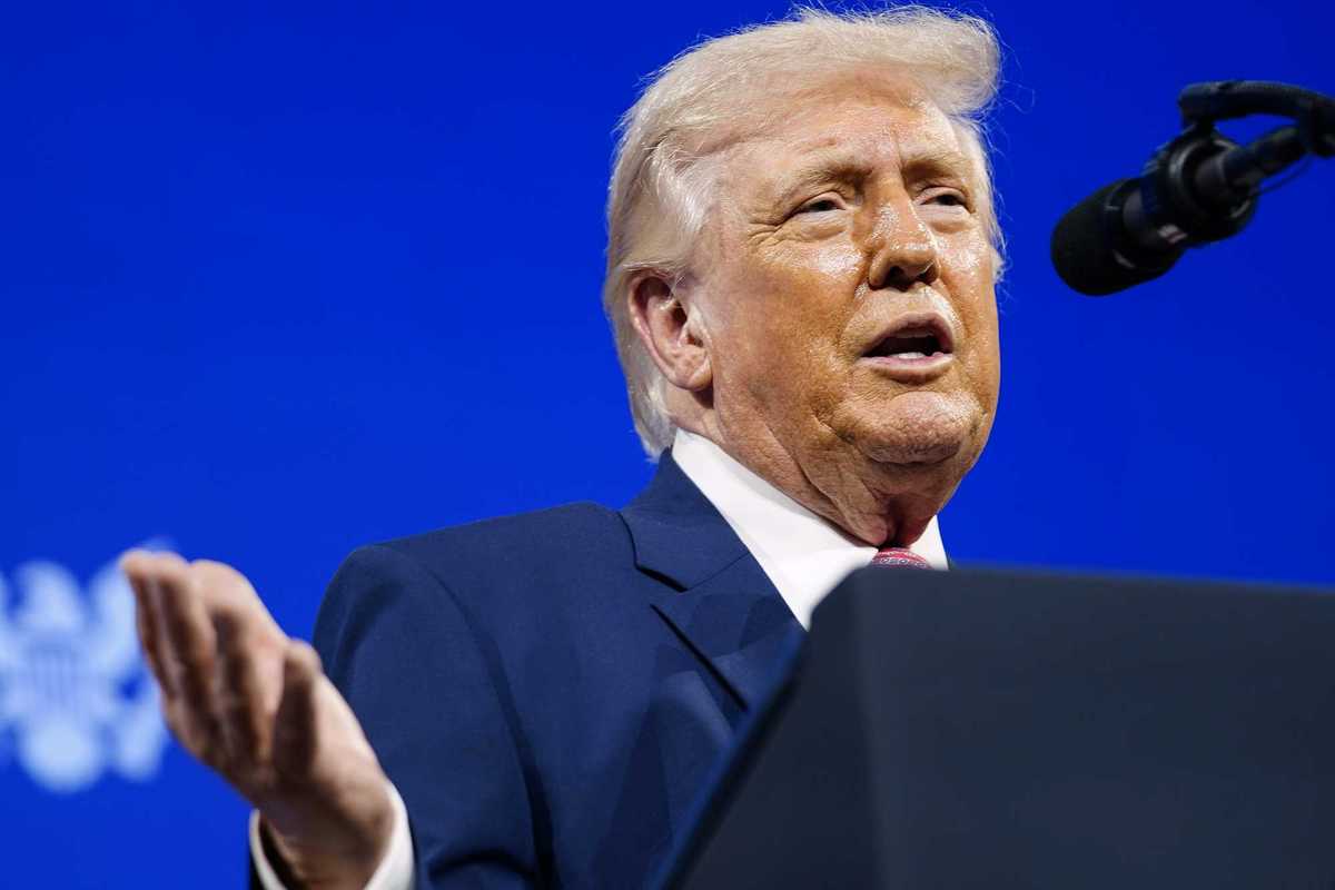 Donald Trump speaks behind a lectern at the Future Investment Initiative summit in Miami.