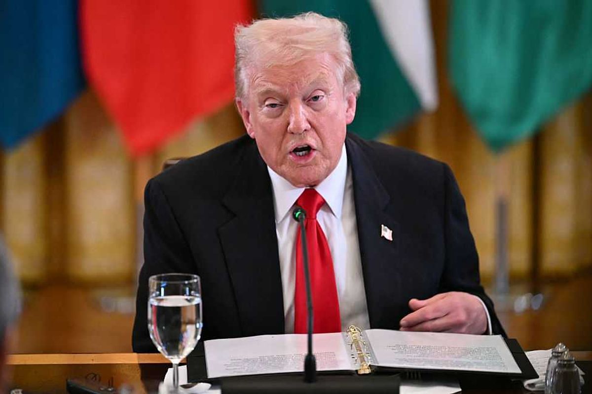 Donald Trump speaks in front of a dinner table during a dinner with Central Asian countries.