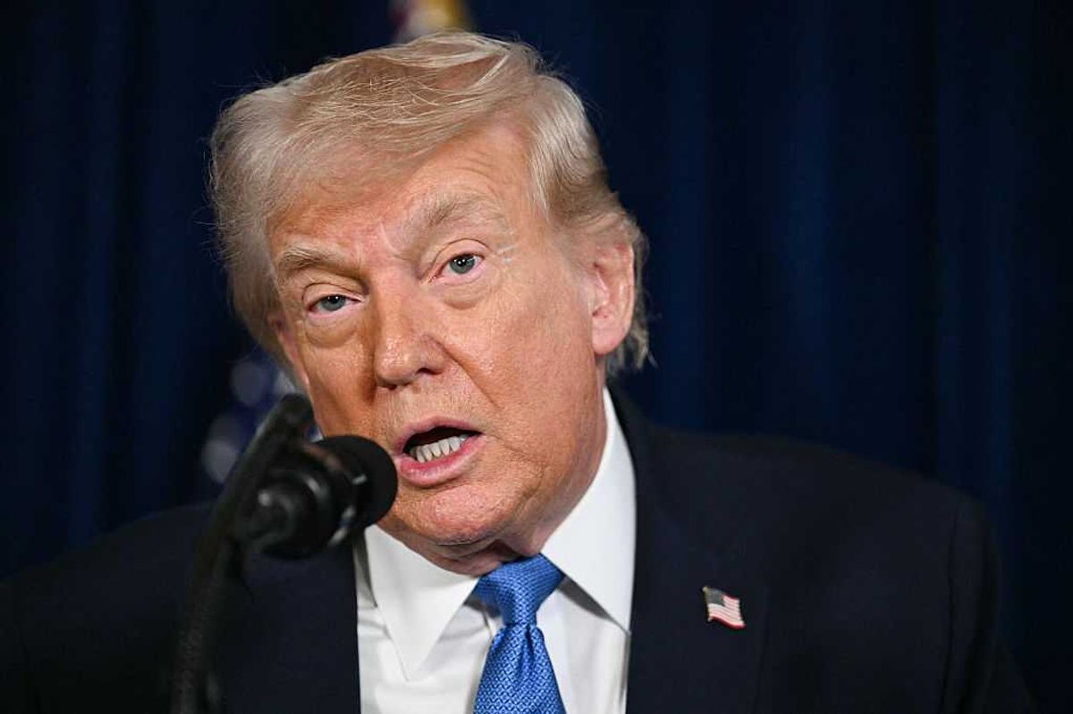 Donald Trump speaks into a microphone during a press conference on Venezuela.