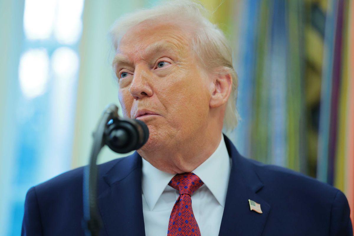 Donald Trump speaks into a microphone during a White House press conference.