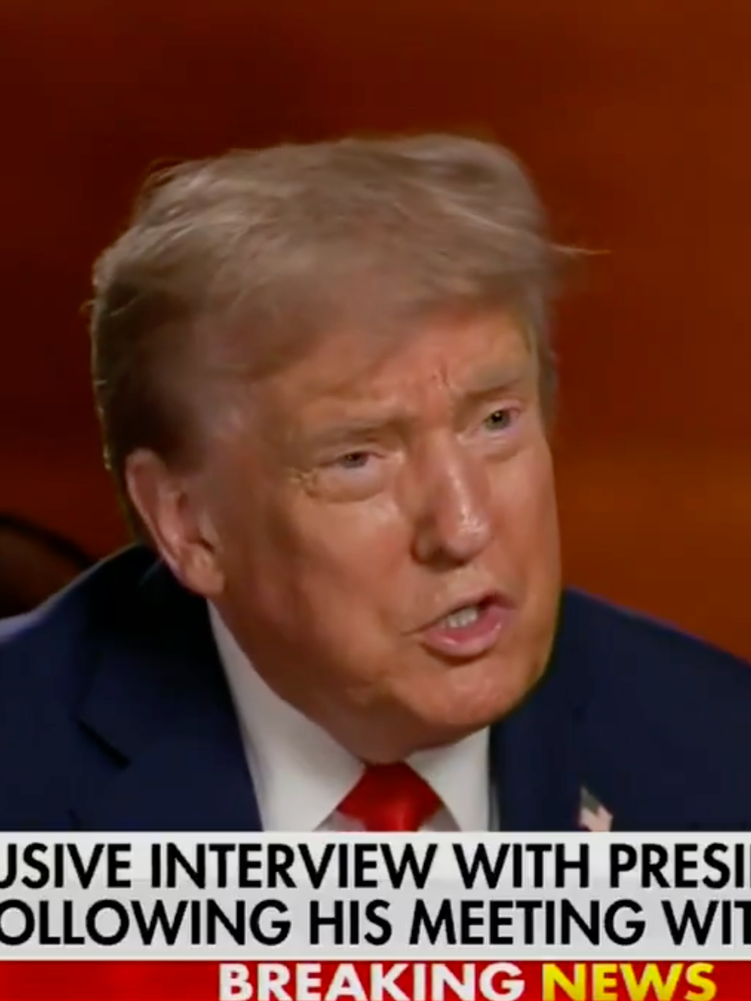 Donald Trump speaks to Sean Hannity (off-camera) in a Fox News interview. The news chyron reads: 'Exclusive interview with President Trump following his meeting with Putin'.
