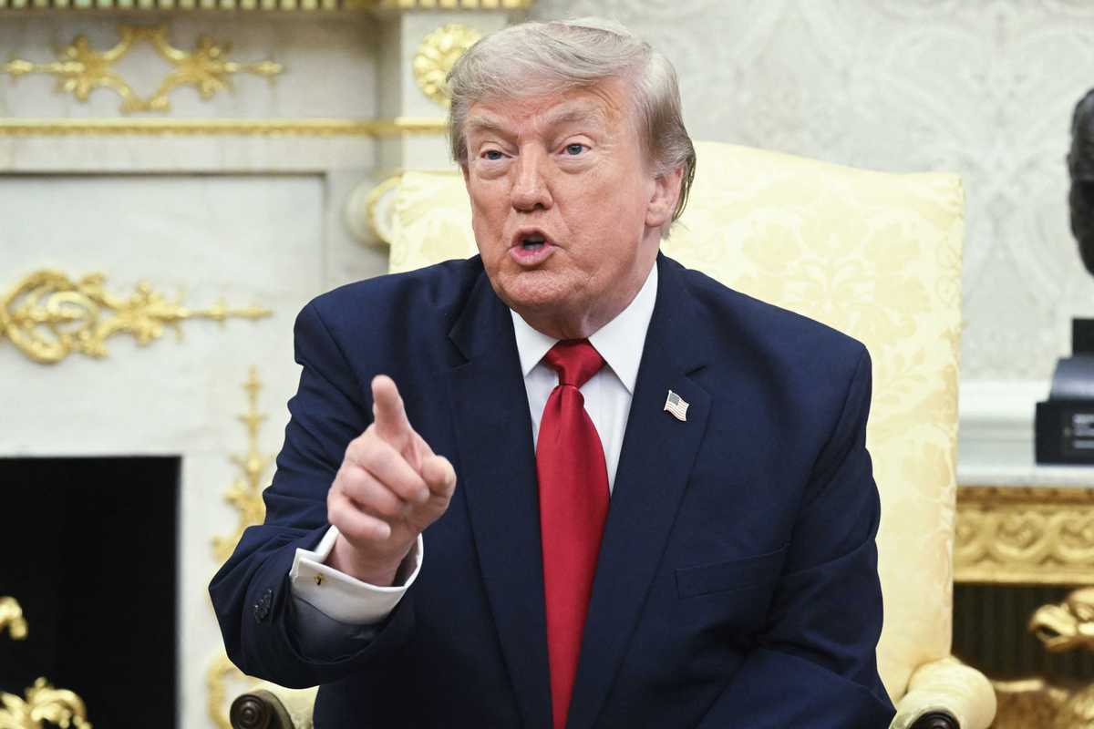Donald Trump talking to reporters inside the Oval Office.