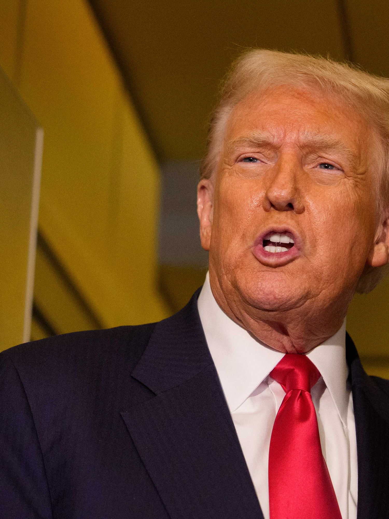 Donald Trump talking to reporters (off-camera) inside Air Force One.