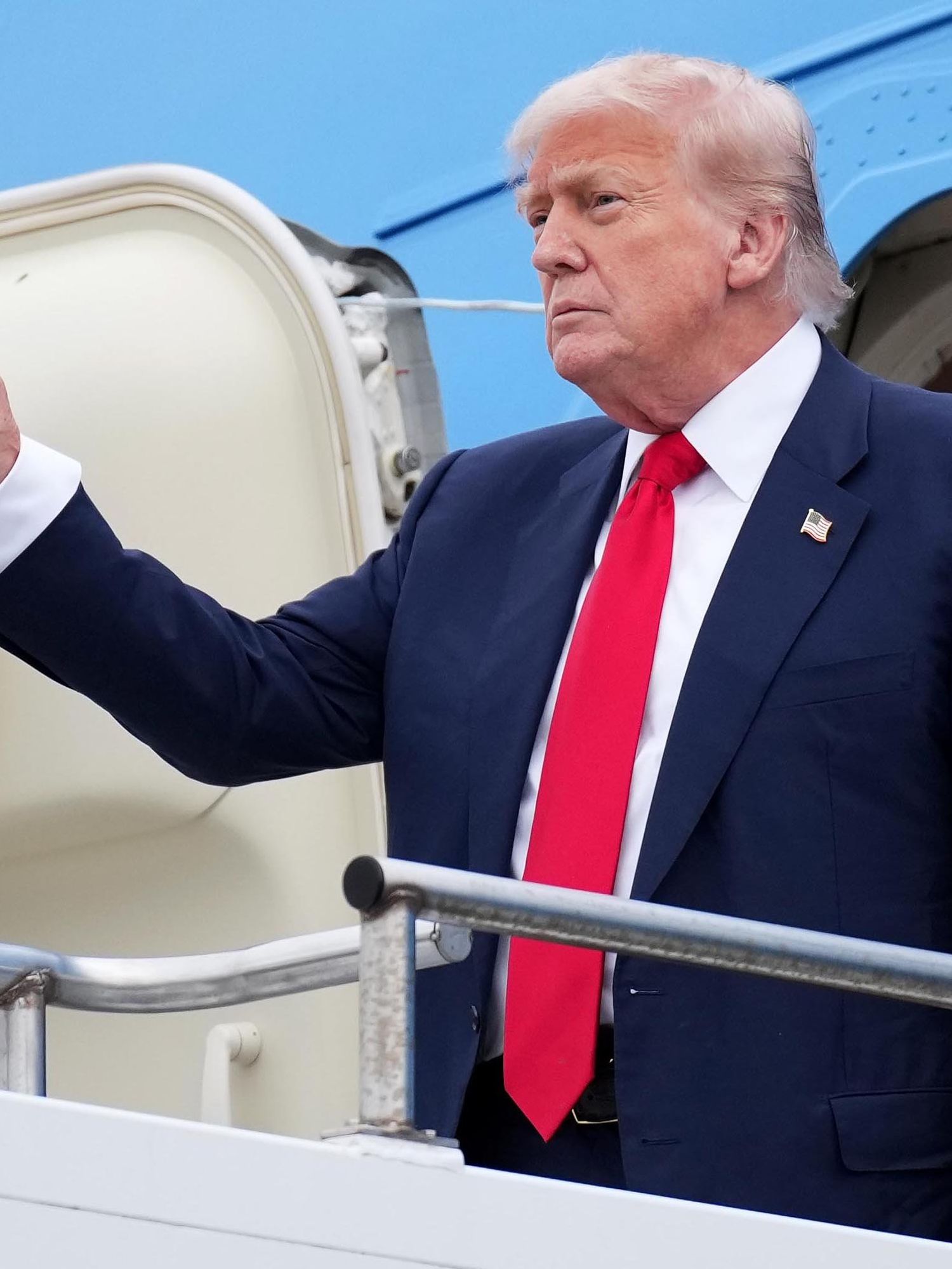 Donald Trump waves outside Air Force One.