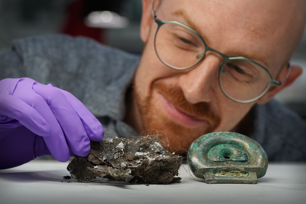 Dr Matthew Knight with some Bronze Age objects