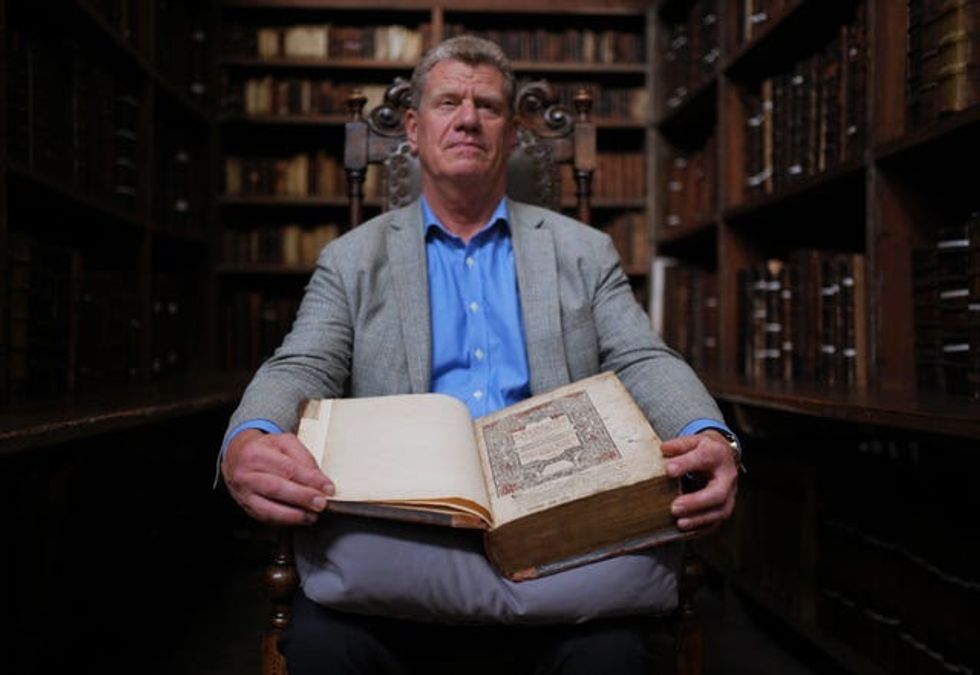 Dr Tony Trowles with the first edition Welsh Bible