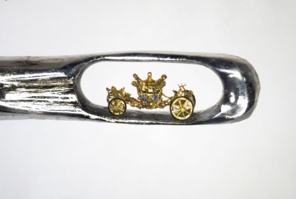 Sculptor creates tiny royal coach in the eye of a needle as Jubilee tribute