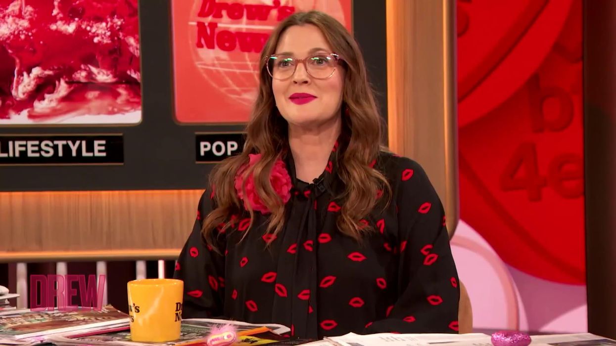 Drew Barrymore jumped over her desk after being surprised by Penn Badgley