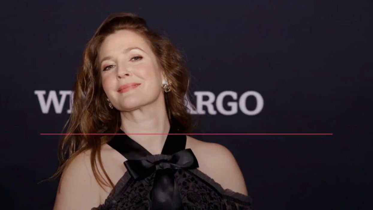 Terrifying moment Drew Barrymore's 'stalker' climbs on stage as she's speaking
