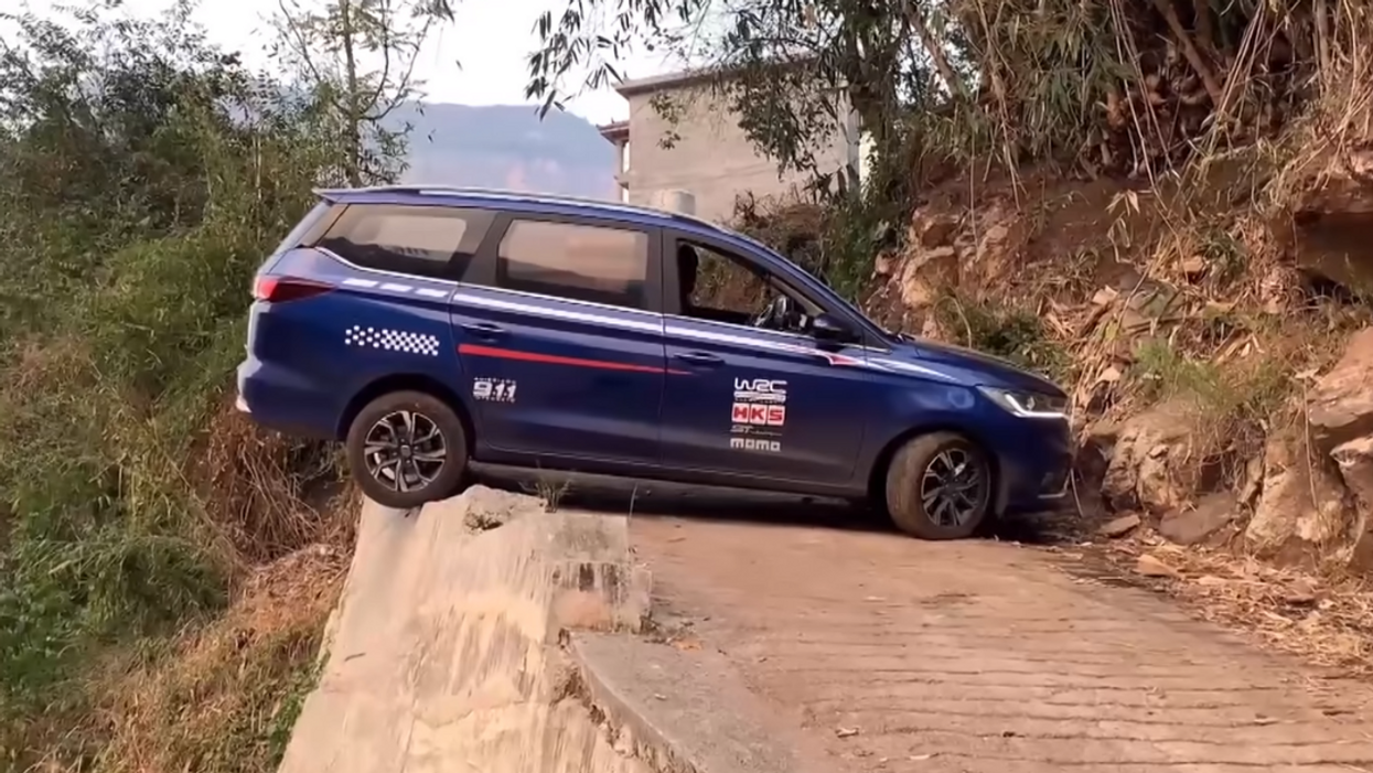 Driver performs a 26-point turn on a narrow road