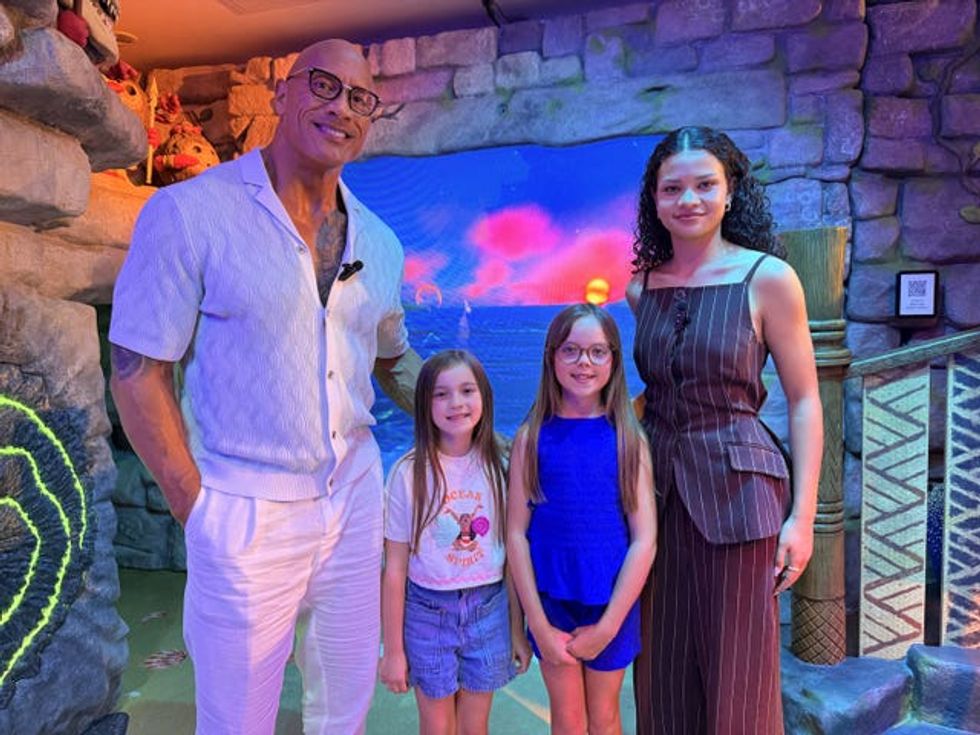 Dwayne Johnson and Catherine Laga\u2019aia, with Bella Riding and her sister Luna