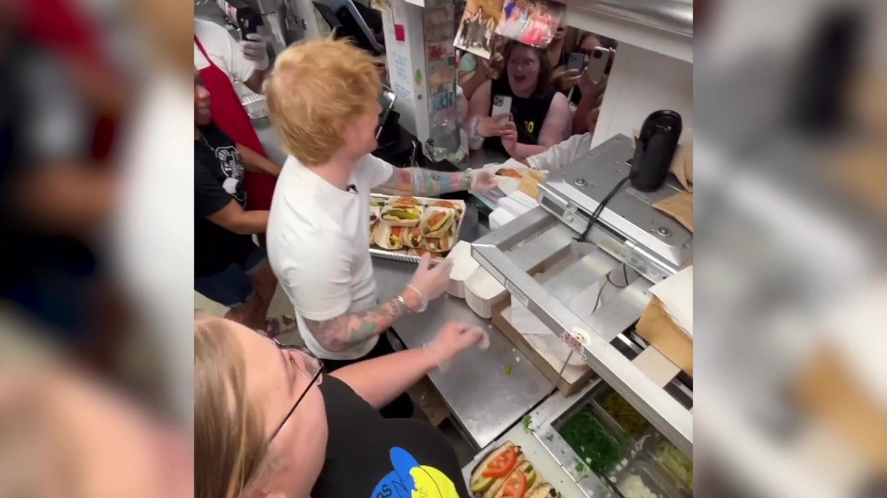 Ed Sheeran spotted serving hotdogs in Chicago - and gets brutal telling off from staff