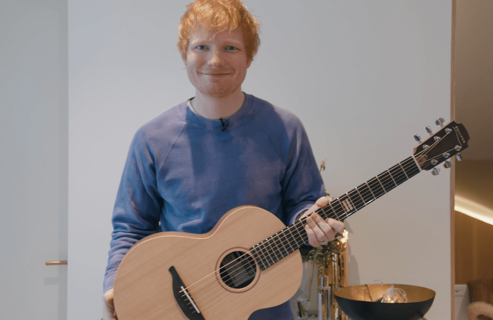 Ed Sheeran with the prototype Equals guitar that he has donated as the prize in a charity raffle (GeeWizz/PA)