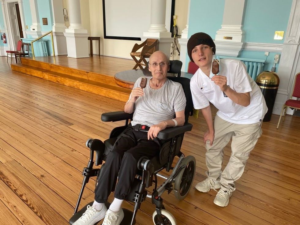 Eddie Brower with his grandson Blake, 15, eating ice cream (Nadine Brower/PA).