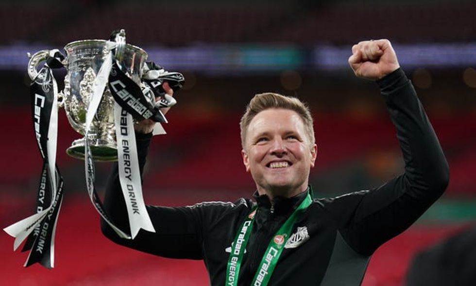 Eddie Howe holding trophy