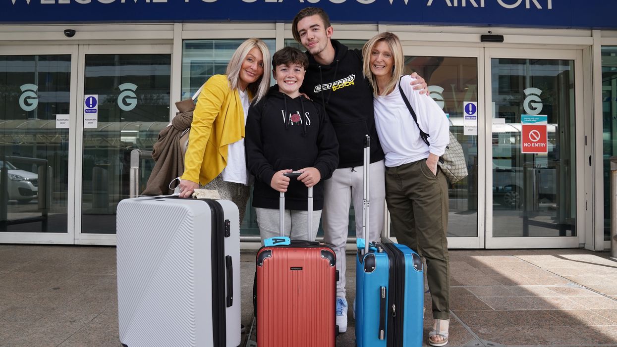 Elaine Burt (right) was reunited with her family after 20 months (Andrew Milligan/PA)