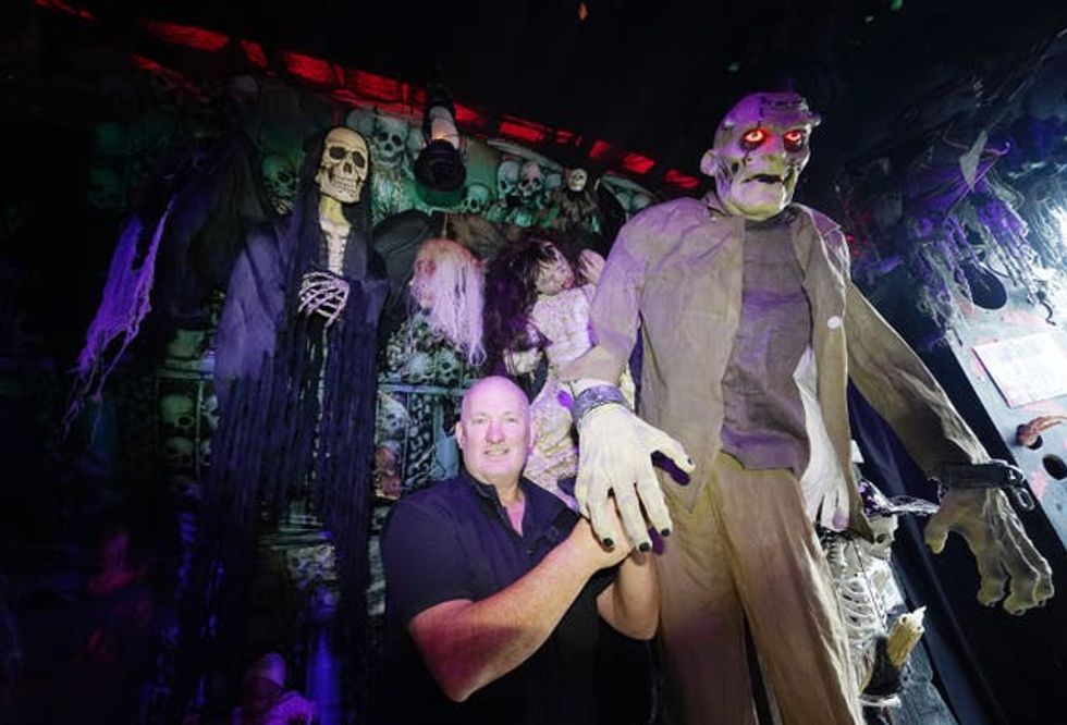 Electrician Ken Carraher continues preparations on his Halloween House of Horrors in Killiney, Dublin