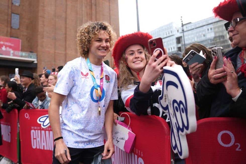 Ellie Kildunne taking a photo with a fan