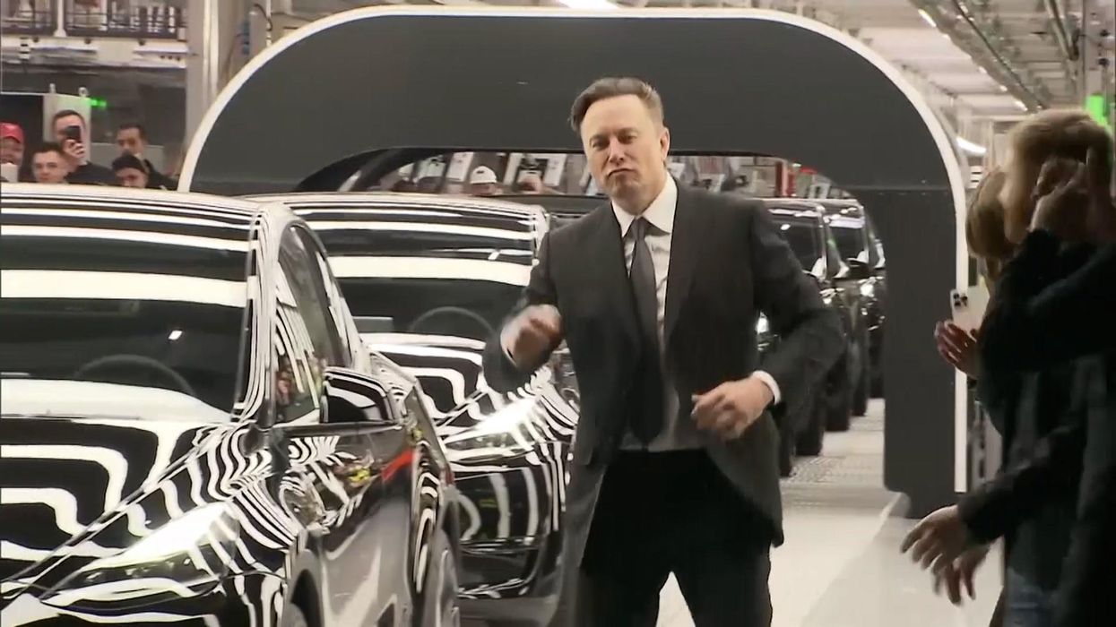 Elon Musk breaks out in dance at opening of Tesla Gigafactory